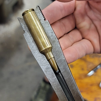 Chambering rifle cartridge